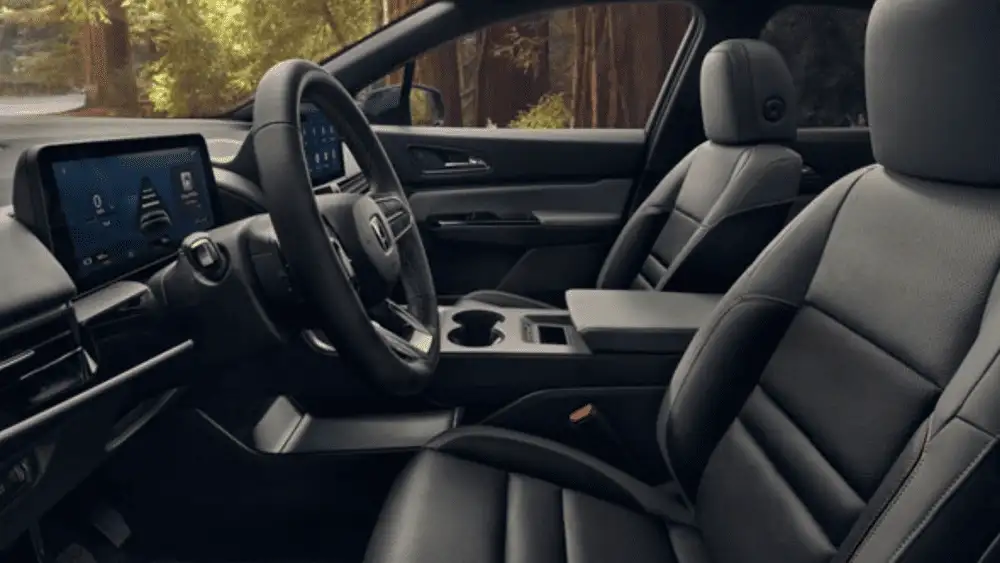 2026 Honda Prologue near Smithtown, NY driver’s view with the steering wheel, infotainment screen, and center console