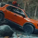 2026 Honda Passport near Smithtown, NY shown on a rocky trail, highlighting ground clearance and rugged weekend-ready capability.