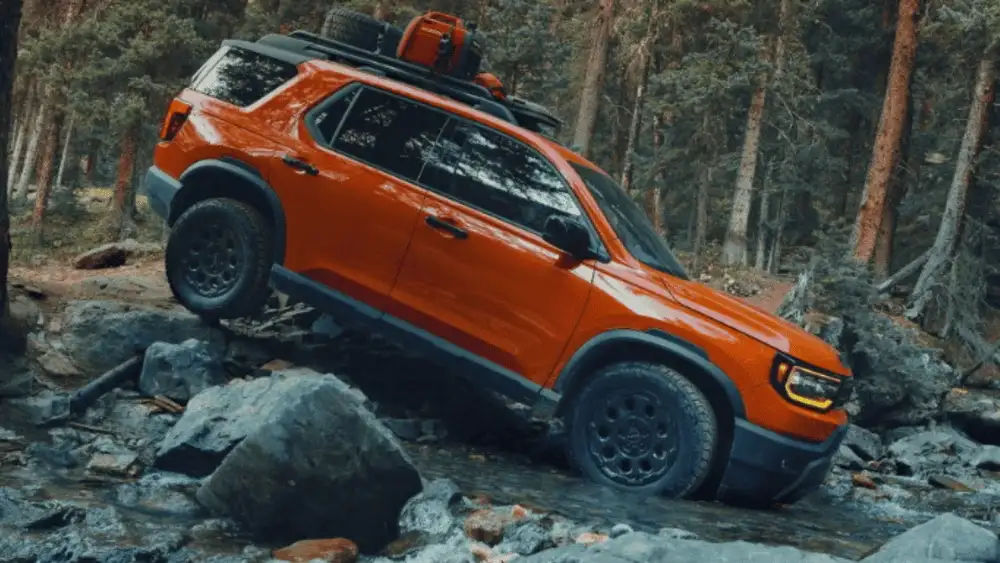 2026 Honda Passport near Smithtown, NY shown on a rocky trail, highlighting ground clearance and rugged weekend-ready capability.