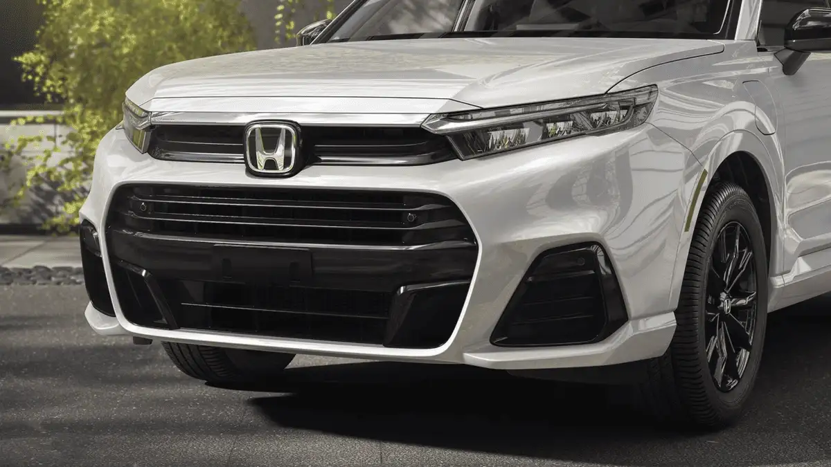 2026 Honda CR-V e:FCEV near Smithtown, NY close-up of the front grille, Honda badge, and LED headlights on a white SUV