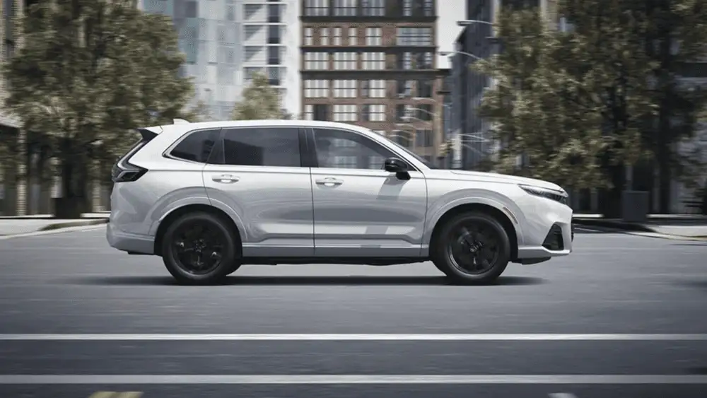 2026 Honda CR-V e:FCEV for Smithtown NY commuters shown in side profile on city streets, highlighting a clean white SUV design