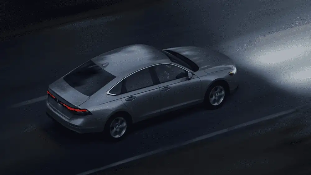 2026 Honda Accord silver sedan aerial view driving on highway at night near Commack NY