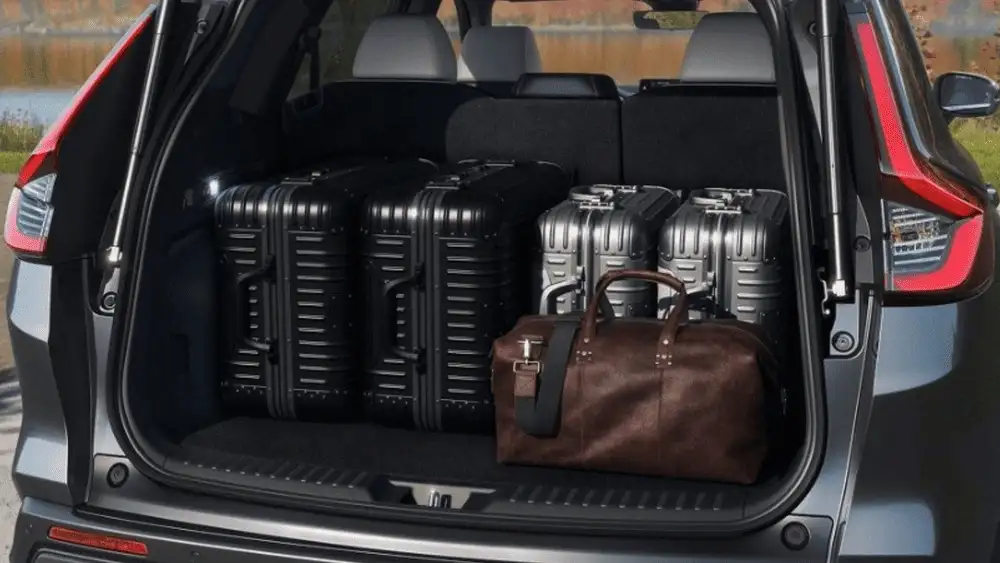 2026 Honda CR-V Hybrid cargo area loaded with luggage and travel bags showing trunk space near Commack NY