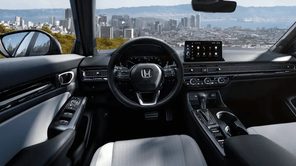 2026 Honda Civic Sedan cockpit with Honda steering wheel and touchscreen infotainment system near Commack NY