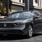2026 Honda Accord in Meteorite Gray front three-quarter view parked on city street — comfortable April getaways for couples near Commack NY
