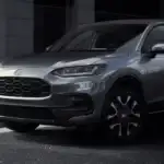 2026 Honda HR-V in Lunar Silver Metallic front three-quarter view on urban street — daily commutes made easy for urban professionals near Commack NY