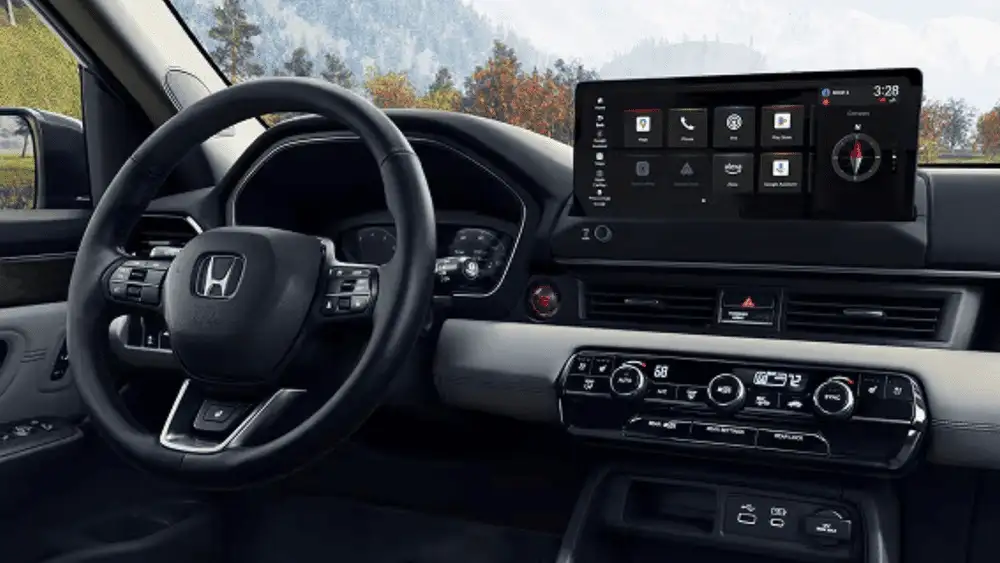 2025 Honda Pilot interior dashboard with Honda steering wheel and large touchscreen infotainment near Commack NY