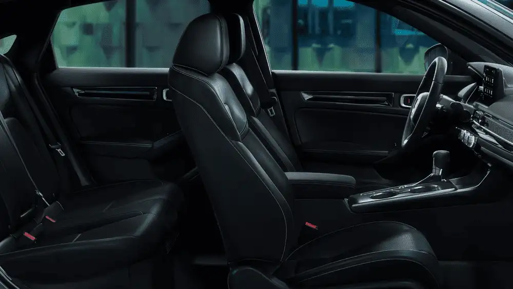 2026 Honda Civic Hatchback black leather front and rear seat interior side view near Commack NY