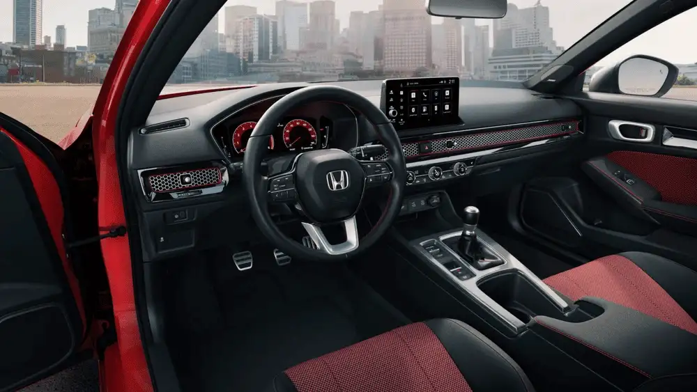 2026 Honda Civic Si sport interior with red and black seats manual shifter and touchscreen near Commack NY