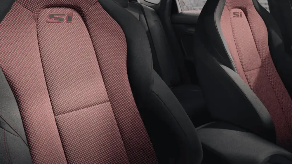 2026 Honda Civic Si sport seats with red and black Si-badged upholstery front and rear near Commack NY