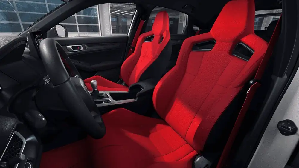 2025 Honda Civic Type R bold red sport bucket seats with manual shifter and black steering wheel interior