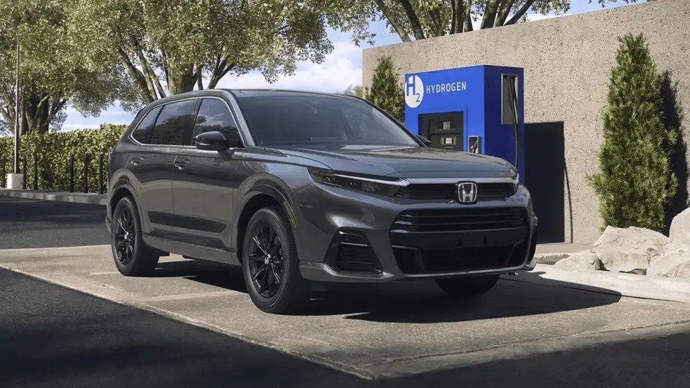 2026 Honda CR-V e:FCEV hydrogen fuel cell SUV in gray parked at H2 hydrogen fueling station