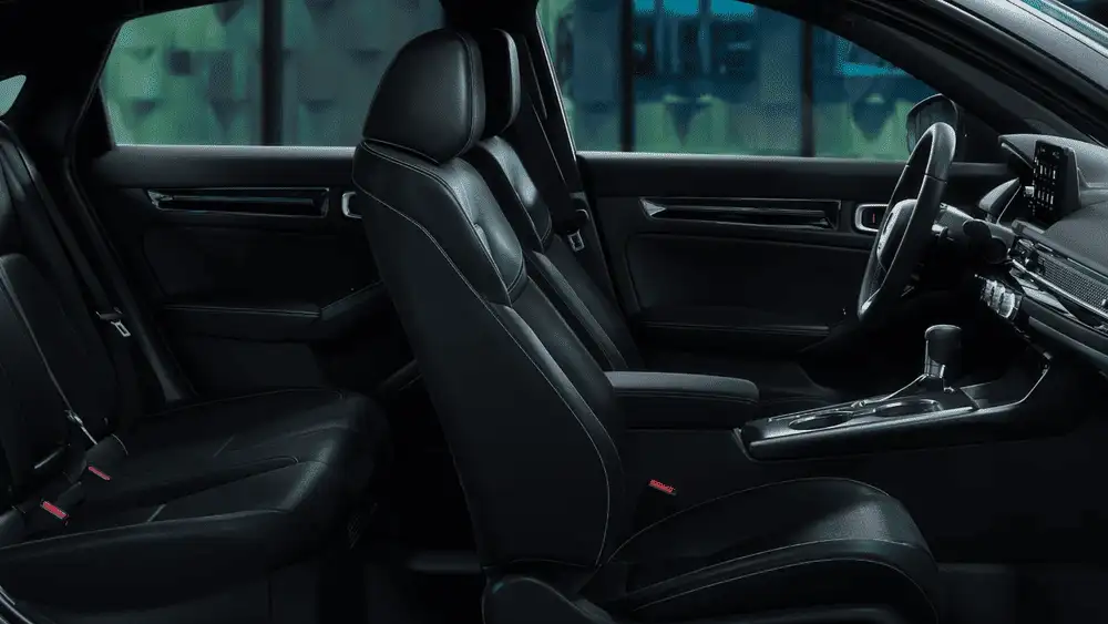 2026 Honda Civic Hatchback Hybrid black leather front and rear seats interior side view