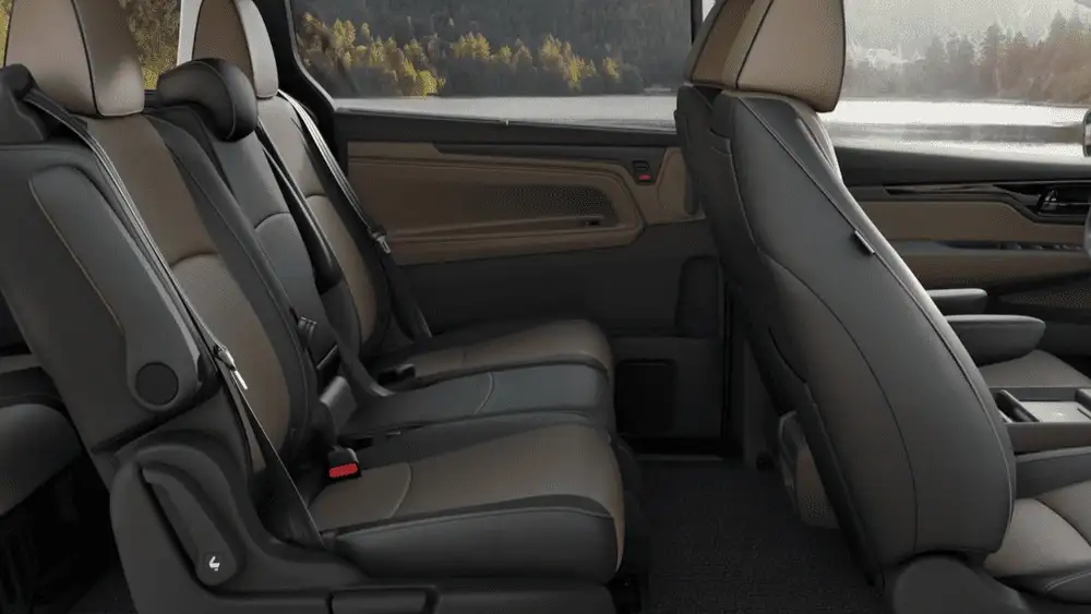 2026 Honda Odyssey second and third row black and brown leather passenger seating interior side view