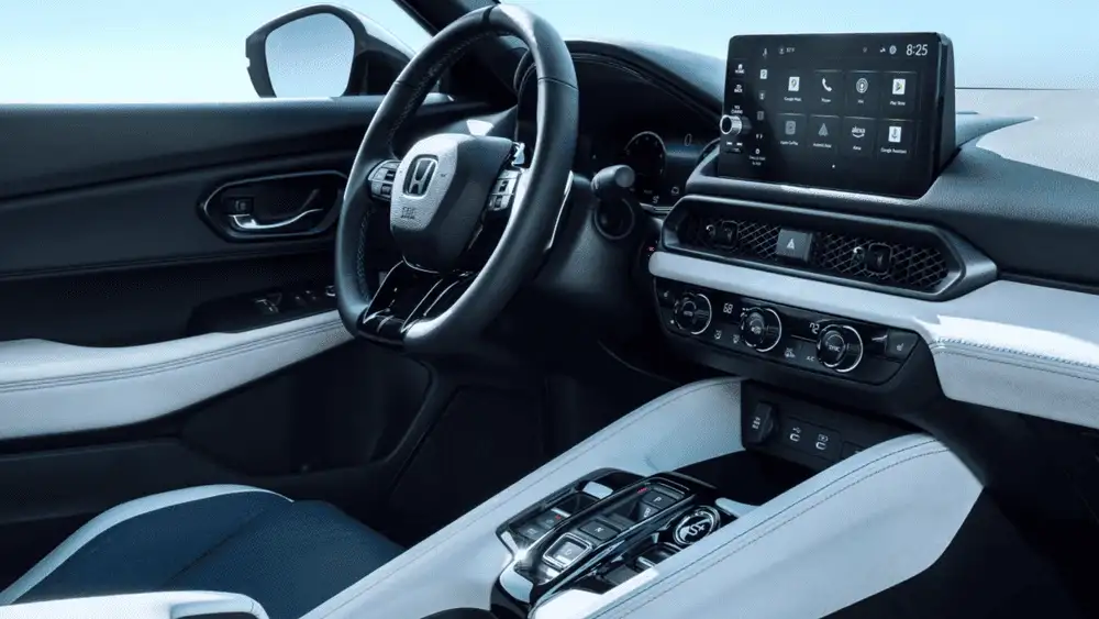 2026 Honda Prelude Hybrid interior cockpit with Honda steering wheel white and black trim and touchscreen display