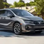 Gray 2026 Honda Odyssey minivan parked near a park, comparing it to the Kia Carnival around Commack NY