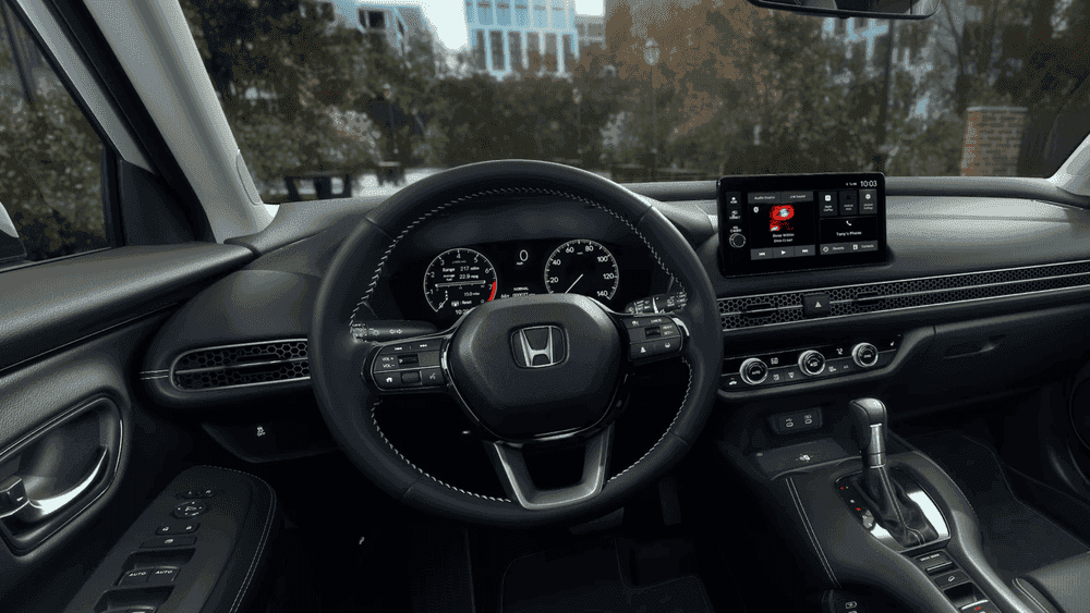 2026 Honda HR-V driver cockpit showing the Honda steering wheel, instrument cluster, and touchscreen near Hauppauge NY