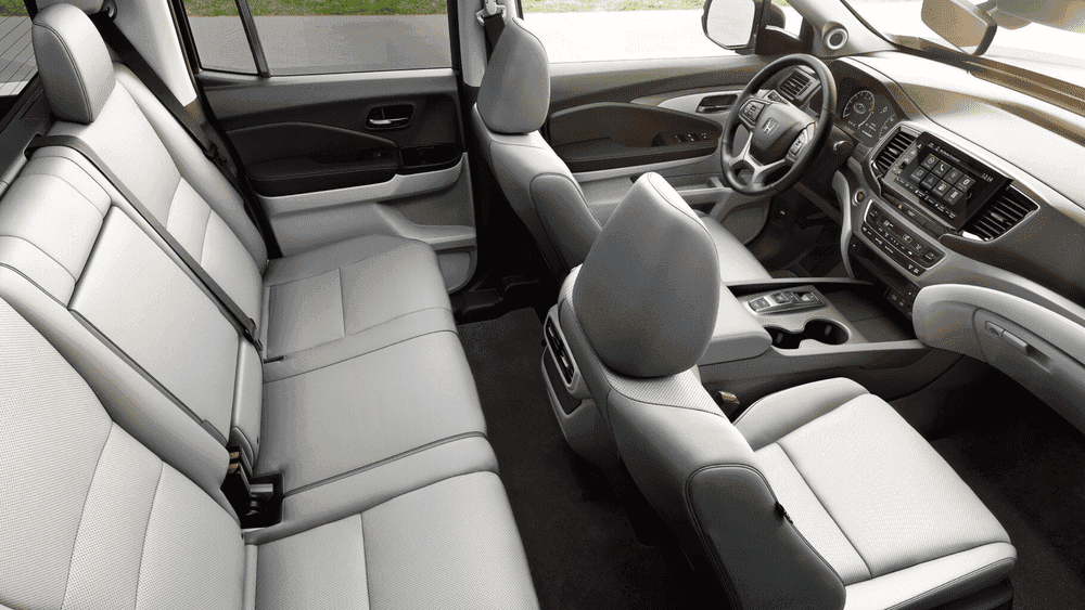 2026 Honda Ridgeline spacious gray leather front and rear cabin seating with touchscreen visible near Hauppauge NY