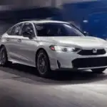 White 2026 Honda Civic Sedan speeding through a lit tunnel, a smart commuter choice near Hauppauge NY