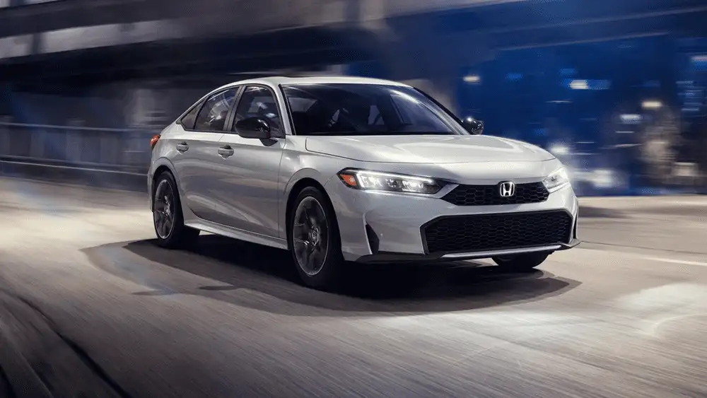 White 2026 Honda Civic Sedan speeding through a lit tunnel, a smart commuter choice near Hauppauge NY