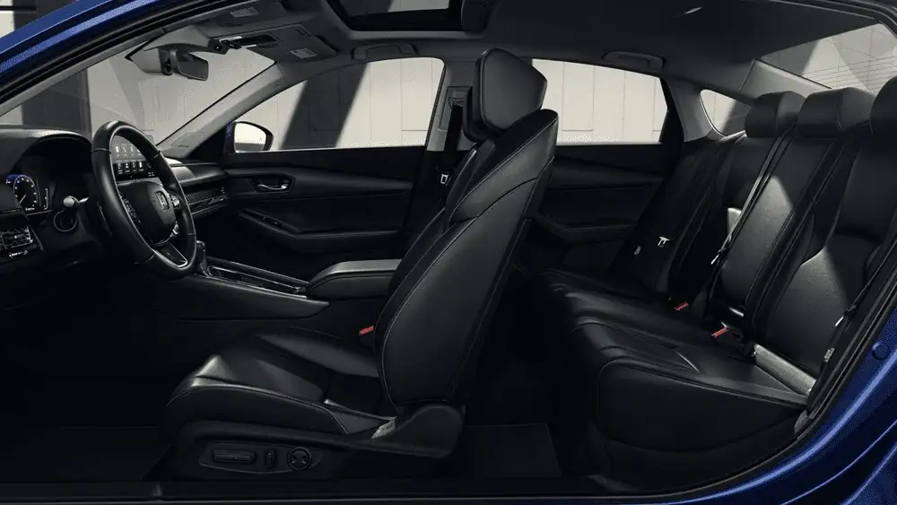 Black leather seats inside a 2026 Honda Accord Hybrid near Hauppauge, NY, with a side view of the front and rear cabin.