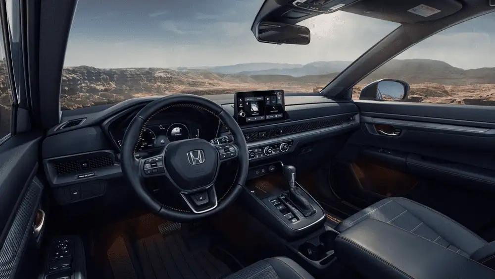 Black interior of a 2026 Honda CR-V near Hauppauge, NY, showing the dashboard and touchscreen display.