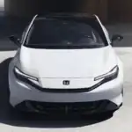 White 2026 Honda Prelude Hybrid near Hauppauge, NY, shown from the front in a parking structure.