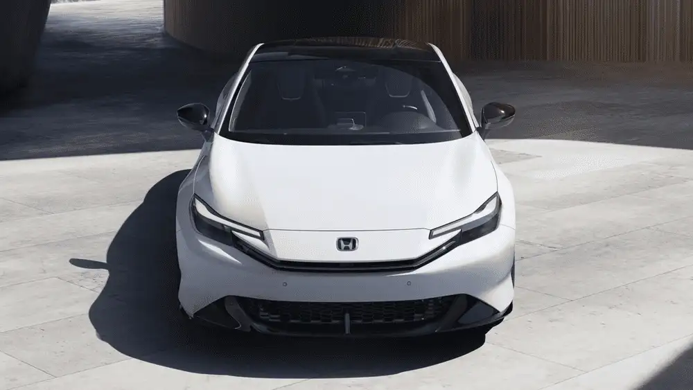 White 2026 Honda Prelude Hybrid near Hauppauge, NY, shown from the front in a parking structure.