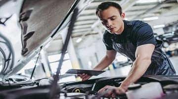 Man inspecting car