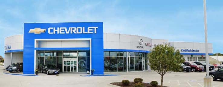 An exterior shot of a Chevrolet dealership at night.