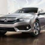 2018-civic-sedan-touring-ext-nh-830-78-front-driver-static-1400-1x