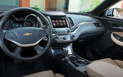 An exterior shot of three cars