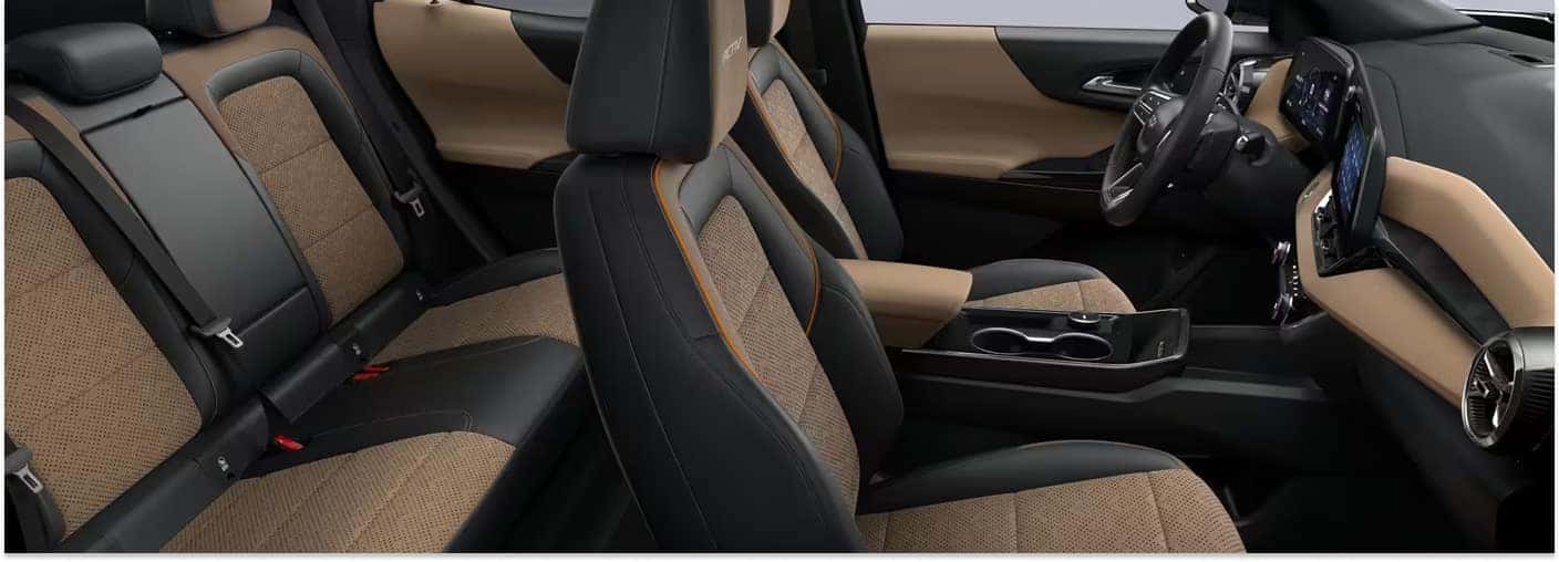 Interior cabin of a 2026 Chevrolet Equinox with black and Maple Sugar two-tone seating.
