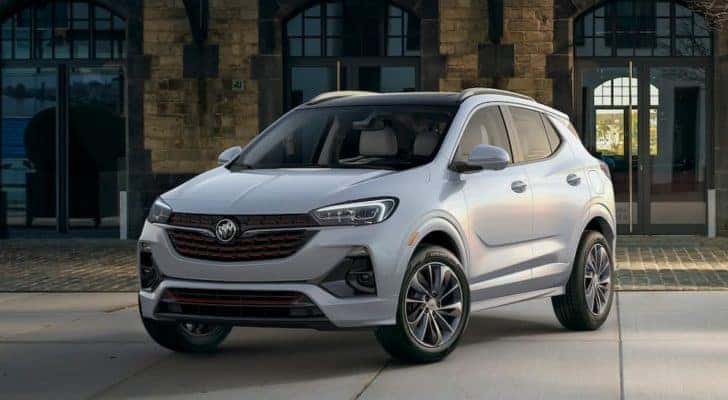 A white 2021 Buick Encore GX is shown in front of a brick building after leaving a Murfreesboro Buick dealer.