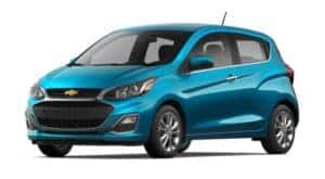 A blue 2022 Chevy Spark is angled left.