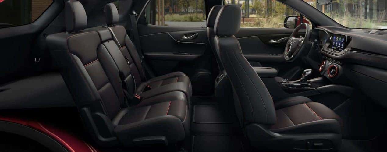 The black interior of a 2022 Chevy Blazer shows two rows of seating.