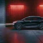 A black 2023 Chevy Bolt EUV Redline Edition is shown from the side in a warehouse after visiting a Murfreesboro Chevy dealer.
