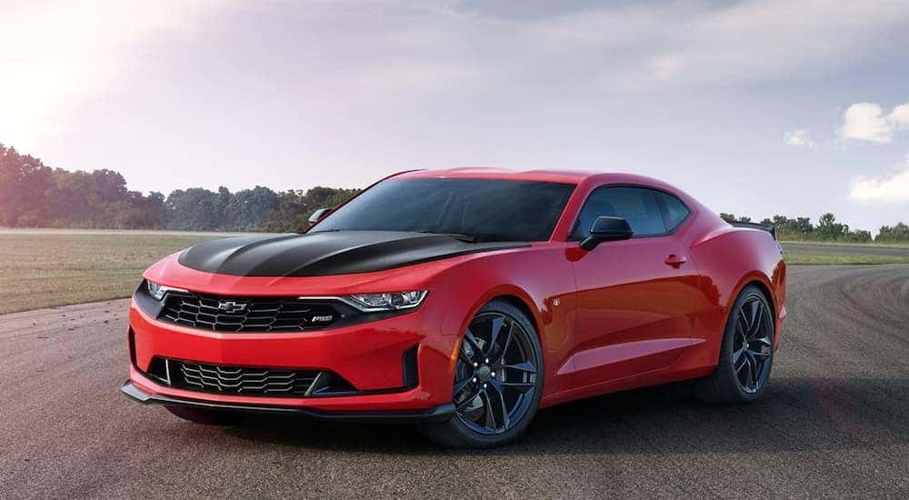 A red Certified Pre-Owned 2020 Chevy Camaro is shown from the front at an angle