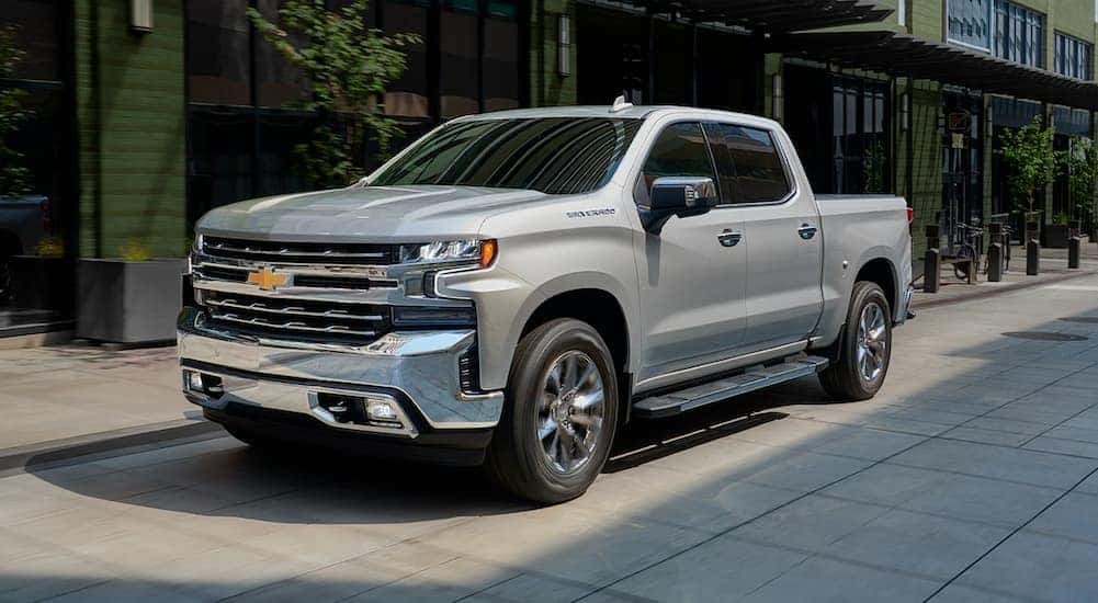 A silver 2019 Chevy Silverado is shown from the front at an angle.