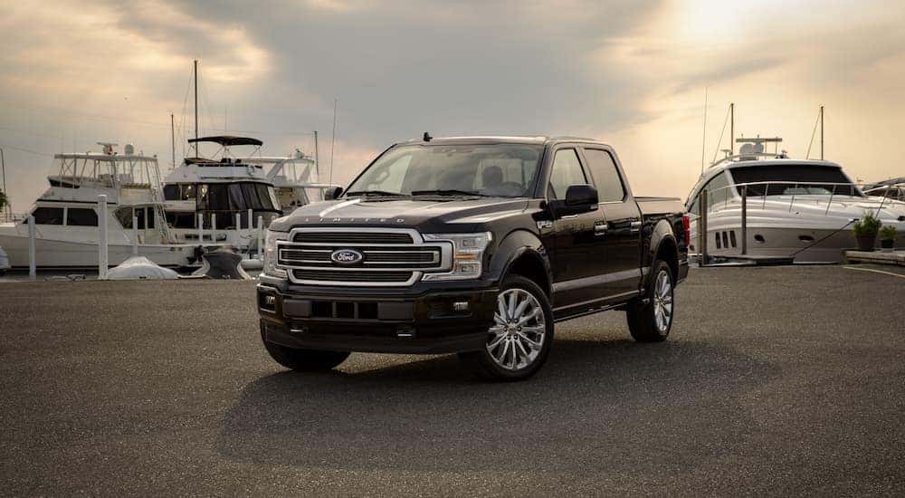 A black 2019 Ford F-150 Limited is shown after leaving a used truck dealership near you.