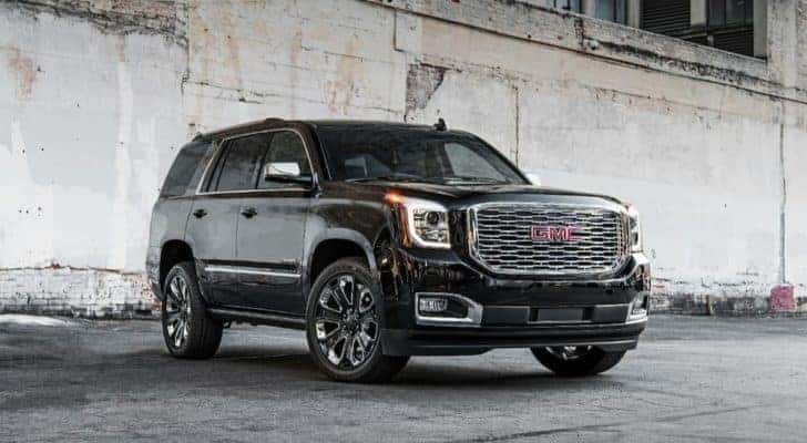 A black 2019 GMC Yukon Denali is shown parked in a garage.