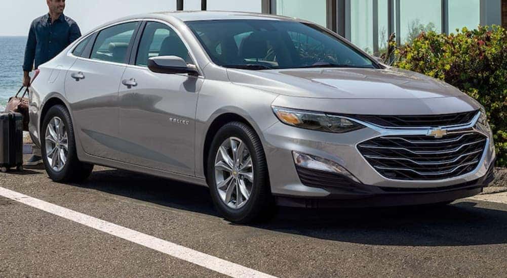 A silver 2021 Chevy Malibu is shown parked from the front.
