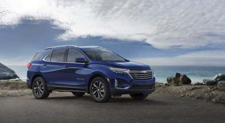 A blue 2022 Chevy Equinox Premier is shown from the side after leaving a Tullahoma Chevy dealer.