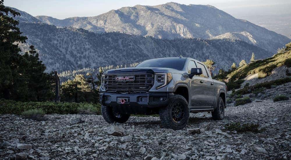 A grey 2023 GMC Sierra 1500 AT4X AEV is shown from the front at an angle.