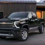 A black 2024 Chevy Silverado 1500 High Country is shown parked on a driveway after visiting a Lewisburg, TN, Chevy dealer.