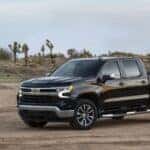 A black 2022 Chevy Silverado 1500 LT is shown from the front at an angle.