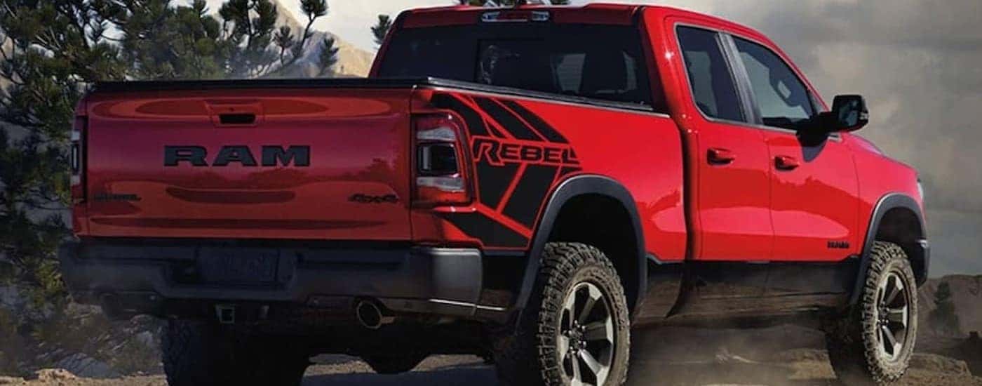 A red 2021 Ram 1500 Rebel is shown parked off-road.