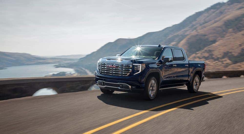 A black 2022 GMC Sierra 1500 Denali is shown from the front at an angle.