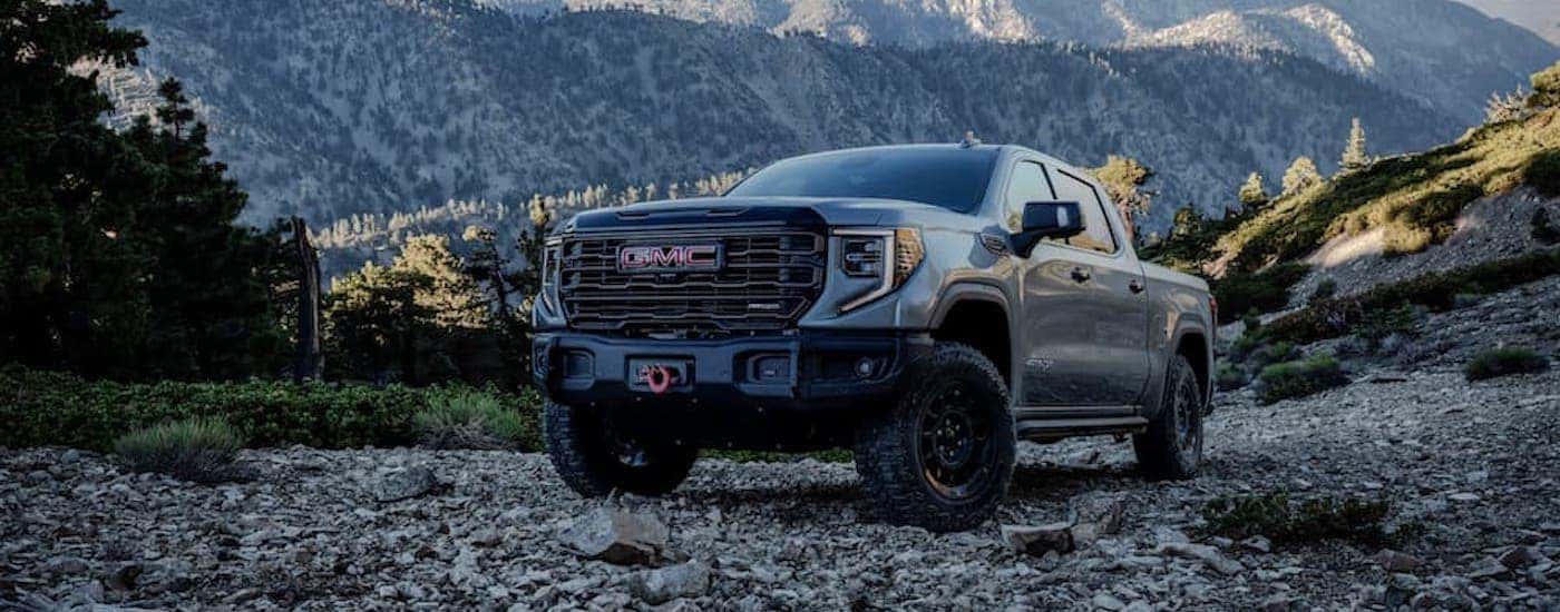 a grey 2023 GMC Sierra 1400 AT4x AEV is shown from the front at an angle.