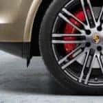 Closeup of a Porsche vehicle's wheel and tire